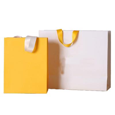 China Recyclable Gift Paper Bag Custom Printed Logo Clothing Shopping Boutique Packaging Carrier Bag Cardboard Paper Bags Luxury for sale