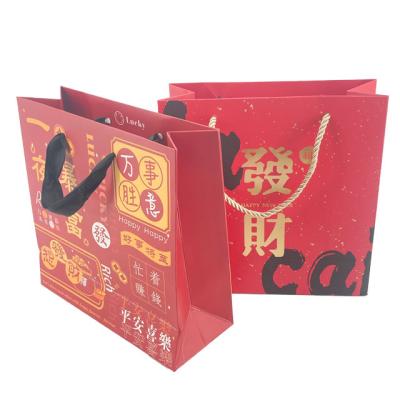 China OEM Business Shopping Biodegradable Packaging Bag Customized Design Blessing Gift Art Paper Packaging Bag With Ribbon Handle for sale