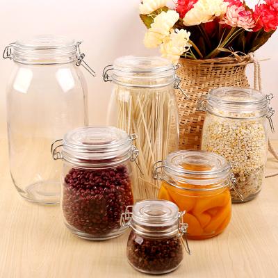 China Freshness Preservation Transparent Super White Round Jar Multigrain Tea Storage Bottle Honey Bottle Glass Sealed Snap Jar Food Candy Jar for sale