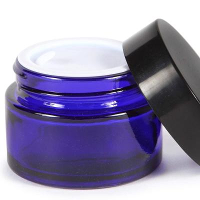 China 1Oz 30ml Cobalt Blue Cobalt Blue Contianer Storage Cream Cosmetic Wholesale Cosmetic Packaging Glass Jar With Black Lid for sale