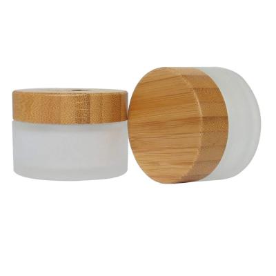 China Hot sale luxury bamboo cosmetic packaging 20g 30g 50g 100g frosted cream glass jars with bamboo lid for sale