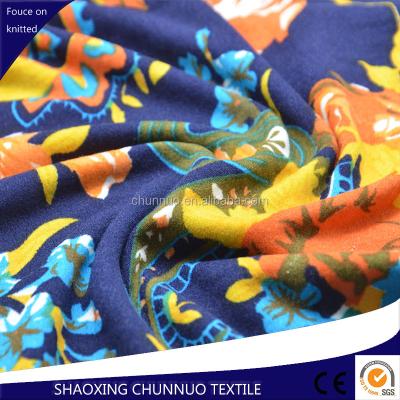 China Stretch Keqiao Chunnuo Textile DTY Brushed Polyester Spandex Flower Printed Fabric for sale