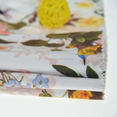 China Chunnuo Textile Hot Selling Stretch Paper Printing Excellent Flower Jersey Knit Garment Fabric for sale