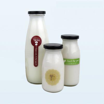 China Beverage China Glass Manufactures Drinkable Beverage Packing Airtight Screw Lids 1 Liter Glass Milk Bottle for sale