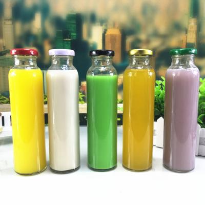 China Beverage Drinking Xuzhou China Manufacture Beverage Drinking Packing Screw Lids Round Glass Juice Bottle for sale