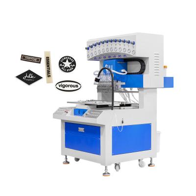 China Máquina automática para hacer logotipos de marcas de 12 colores Bolso de silicona en azul y blanco en venta