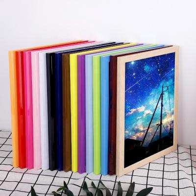 China Modern Simplicity Modern PVC Framed Imitation Wood Grain Children's Art Color Open Photo Frame for sale