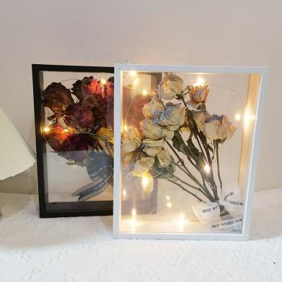 China Simplicity new 4cm modern double hollow flower photo frame wood creative specimen display transparent dry double-sided picture frame for sale