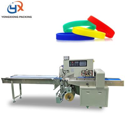 China Multifunctional Horizontal Food Pillow Flow Silicone Products Elastic Bands Packing Machine for sale