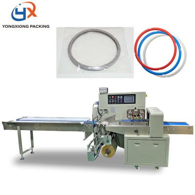 China Multifunctional Horizontal Products Accessities Daily Food Flow Silicone Sealer Ring Packing Machine for sale