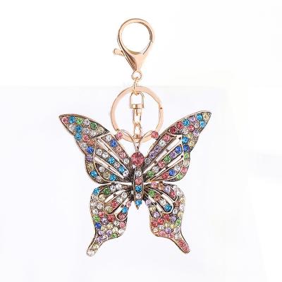 China Bag Car Pendant Accessories Hot Sale European And American Colorful Diamond Inlaid Hollow Butterfly Metal Keychain Creative Small Gift Bag Pendant for sale