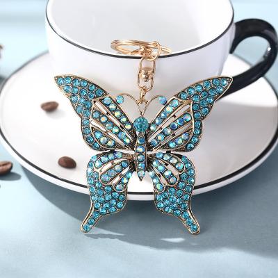 China Bag Car Pendant Accessories Wholesale Creative Small Gift Bag KeyChain Pendant European And American Colorful Diamond Inlay Hollow Butterfly Metal Keychains for sale