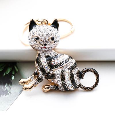 China Bag Car Pendant Accessories 2023 New Arrival Colorful Diamond Inlay Hollow Cat Metal Keychain Europe Fashion Cartoon Keyrings Bag Car Hanging Pendant for sale