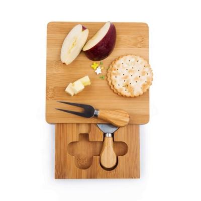 China Bamboo Cheese Board Sustainable Small Kitchen Bamboo Cutting Board With Cheese Knives In Drawer for sale