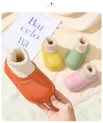 China Solid Color Artificial Short Sleeve Waterproof EVA Home Slipper Wholesale Round Home Children's Winter Shoes Plush Warm Shoes for sale