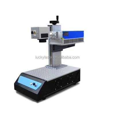 China Automated Loading Customized 3w 5w 3d Flying UV CO2 BJJCZ Fiber Laser Engraving Printing Marking Machine For Metal Jewelry Plastic for sale