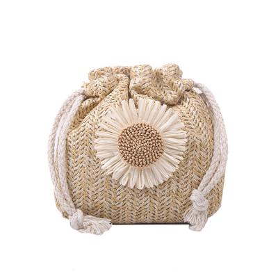 China PORTABLE knit bag new fashion 2022 summer grass weave beautiful ins bucket bag personality girl shoulder messenger bag for sale