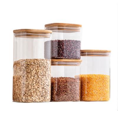 China Steamable High Borosilicate Glass Storage Jar With Bamboo Lid For Square Tube Shaped Storage Glass Jar for sale