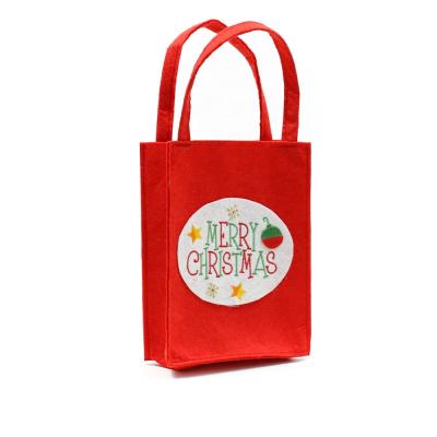 China Recyclable Felt Custom Bulk Christmas Candy Gift Bags With Handles for sale