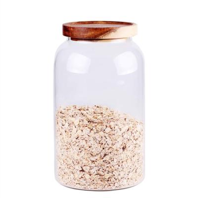 China Freshness Preservation Wholesale Borosilicate Flour Canister Glass Jar Airtight Organizer Tall With Wooden Lids for sale