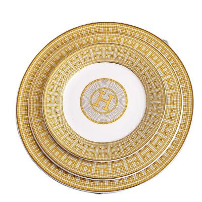 China Sustainable new type gold thin layers porcelain wedding charger attractive price luxury ceramic dishes for sale