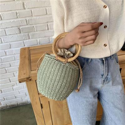 China 2022 Fashion Straw Woven Pot Shape Seaside Holiday New Woven Beach Rattan Bag Ins Female Handbag for sale