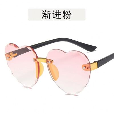 China 2022 Fashion Sun Glasses Metal Love Heart Shape Baby Sunglasses Summer Beach Heart Rimless Kids Sunglasses for sale