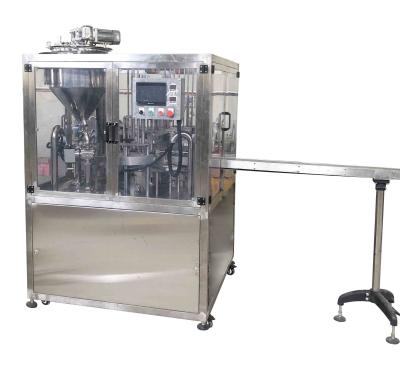 China Dubbele koppen Rotary Cup Filling Sealing Machine Plastic Tube Ketchup Sauce Cup Filling Sealing Te koop