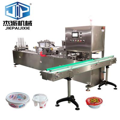 China Automatic Cup Sealing Machine Cover Capping Machine With PLC Control - 700kg Stainless Steel 2.0kW for sale