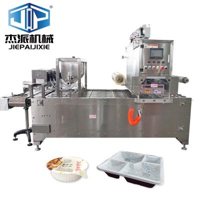 China PLC-besturingssysteem Zilveren automatische trayverzegelmachine voor voedselcontainers Te koop