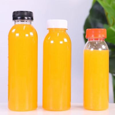 China Water 250ml 330ml 350ml 450ml 500ml Beverage Milk Juice Round Shape Plastic Juice Bottle Food Grade Beverage Bottle With Cap for sale