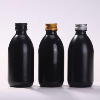 China Custom Black Glass Beverage Bottle 250ml 8oz Black Round Bottles for sale