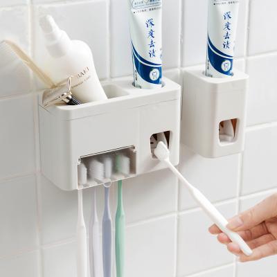 China Automatic Toothbrush Holder Toothpaste Dispenser Holder Set Bathroom Accessories Toothbrush Stand Wall Mount Holder Bathroom Tool Kit for sale