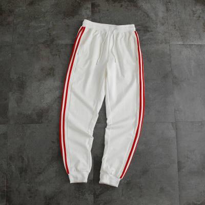 China Spring Autumn Sweatpants Casual Pocket Loose Anti-wrinkle Plus Size Fitness Breathable Cotton Unisex Jogging Pants for sale