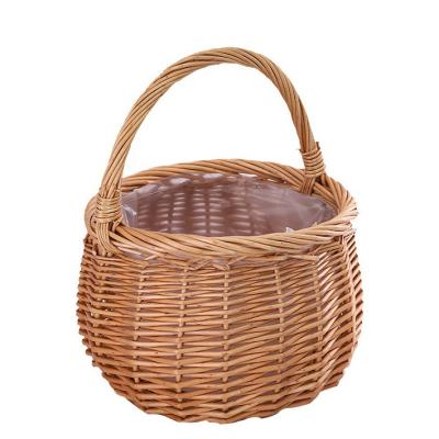 China Sustainable Wholesale Woven Wicker Basket Basket With Handle For Flower Arrangement for sale