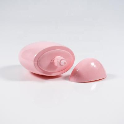 China Custom pink color hand shape egg BEAUTY PE bottle 60ml 2oz PE bottle sunblock cream bottle for sale