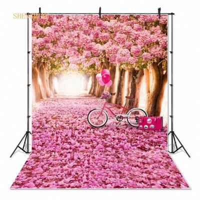 China Seamless pink flower trees photography backdrops garden road bicycle photo backgrounds for studio props romantic weddings for sale