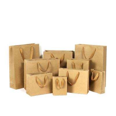 China Wholesale Low Moq Paper Bags Retail Goods Handmade Kraft Paper Bags With Your Own Logo Custom Printed for sale