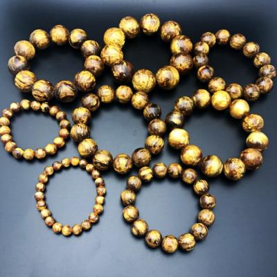 China New high vintage gold sea willow mala beads imitated amber bracelet, luckly accessory religion wood bracelet for men for sale