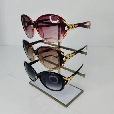 China Modern Professional Logo Sunglasses Store Eyewear Metal Display Custom Glasses Stand for sale