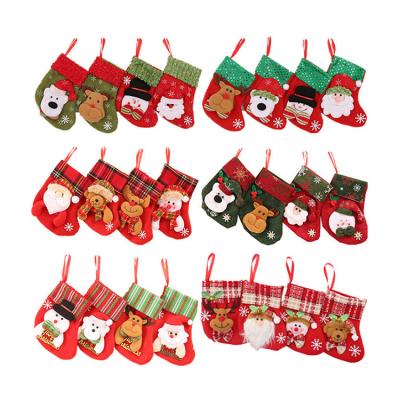 China 3D Nicro Plush Santa Xmas Fireplace Hanging Stockings Christmas Party Supplies Indoor Decoration Set for sale