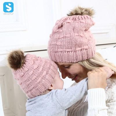 China JOINT High Quality Winter Baby Hats Cute Mommy and Me Pompom Cute Solid Warm Beanie Cap Women Beanie Hats Knitted Beanie Hats for sale