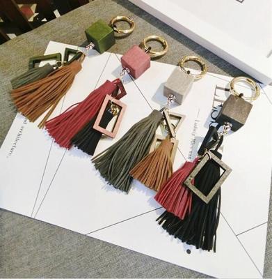 China FAMA Wooden Customized Fancy Personalized Leather Tassel Key Chain for sale