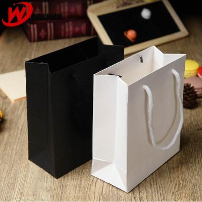 China Shock resistance wholesales fancy cheap high quality black white custom printing paper gift bag with handle for sale