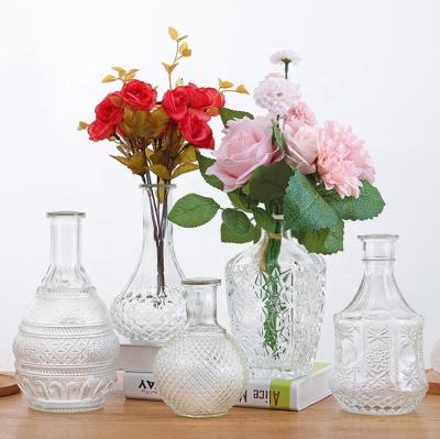 China Modern designed luxury decorative glass flower vase of various shapes home decoration for wedding festival for sale