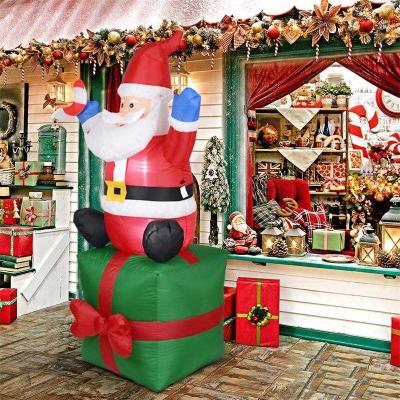 China Outdoor Christmas Holiday Decoration Santa Claus Carrying Gift Blow Up Inflatable With Led Light Up Giant Xmas Inflatables The Outdoor Yard for sale