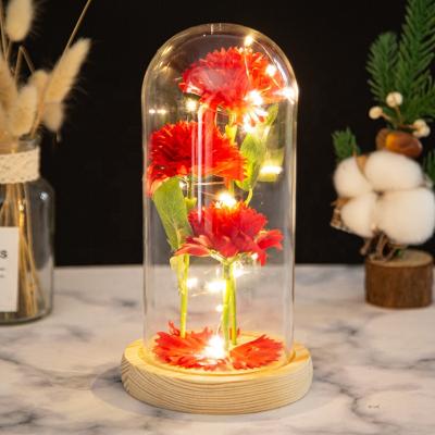 China Creative Teacher's Day Gift Three Nutcracker Christmas Ornament Carnations Glass Cover Ornaments Small Flower LED Light Gift for sale