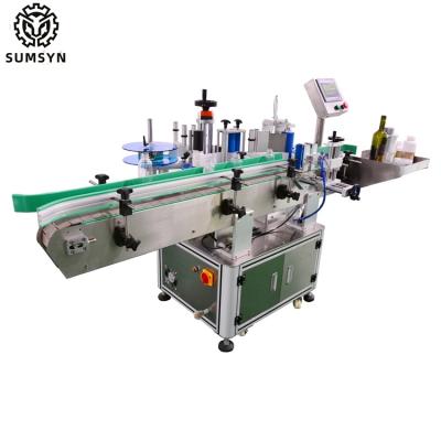 China Automatic round bottle labeling machine bottle label applicator for jars cans wine beer glass plastic bottle labeling for sale