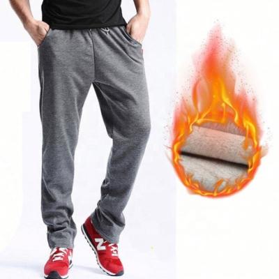 China Breathable Men's Casual Pants Plus Thick Velvet Sports Pants Loose Jogging Pants For Male for sale