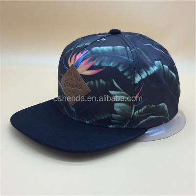 China JOINT Full Flower Print Mesh Snapback Cap Custom Trucker Hat With Leather Patch for sale